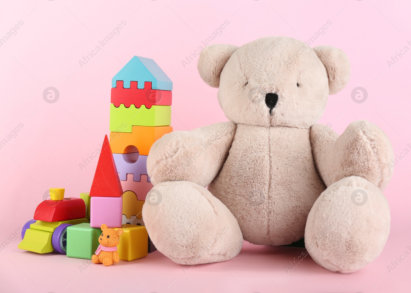 Photo of Set of different toys on pink background