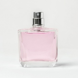 Transparent bottle of perfume on white background