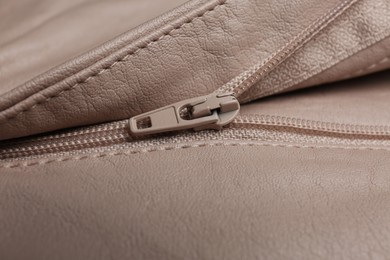 Photo of Pink leather jacket with zipper as background, closeup view