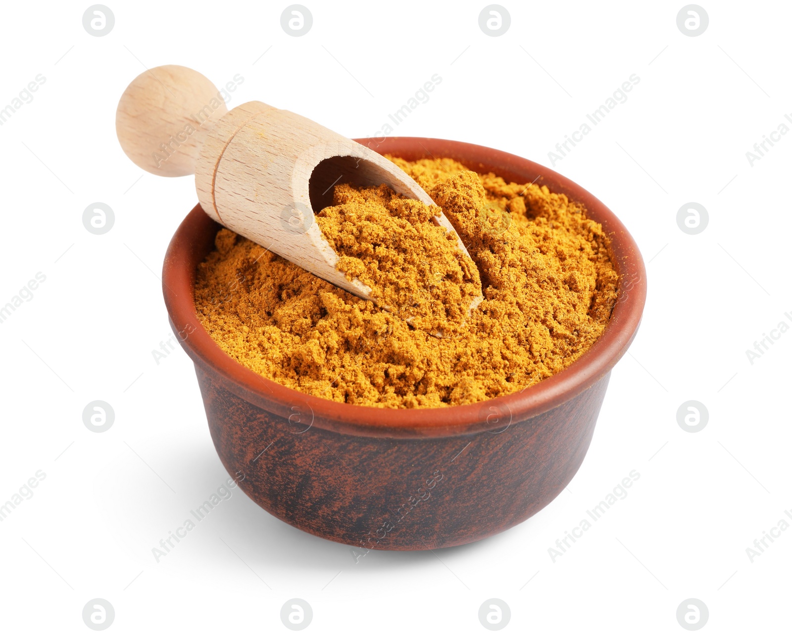 Photo of Curry powder in bowl and scoop isolated on white