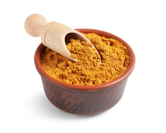 Curry powder in bowl and scoop isolated on white