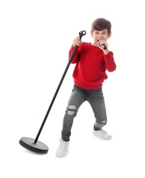 Photo of Cute little boy singing into microphone on white background