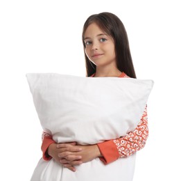 Photo of Cute girl wearing pajamas with pillow on white background