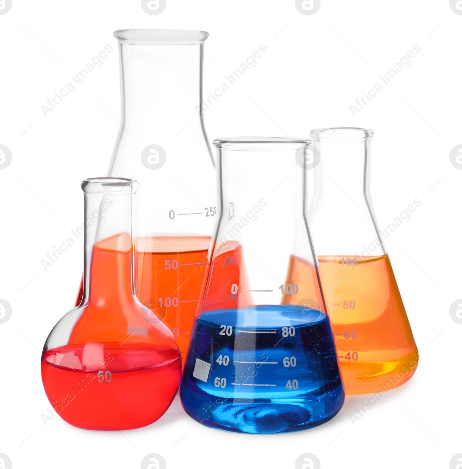 Photo of Different laboratory glassware with colorful liquids on white background