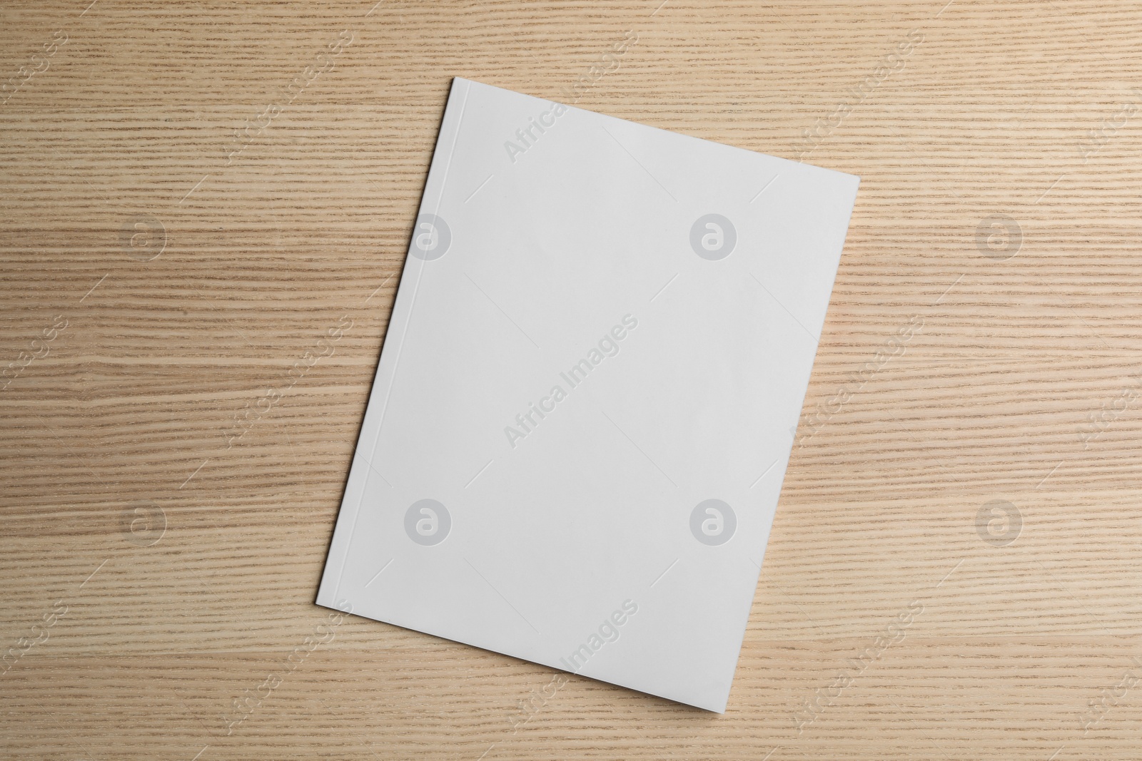 Photo of Brochure with blank cover on wooden background, top view. Mock up for design