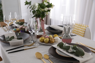 Photo of Beautiful Easter table setting with festive decor indoors