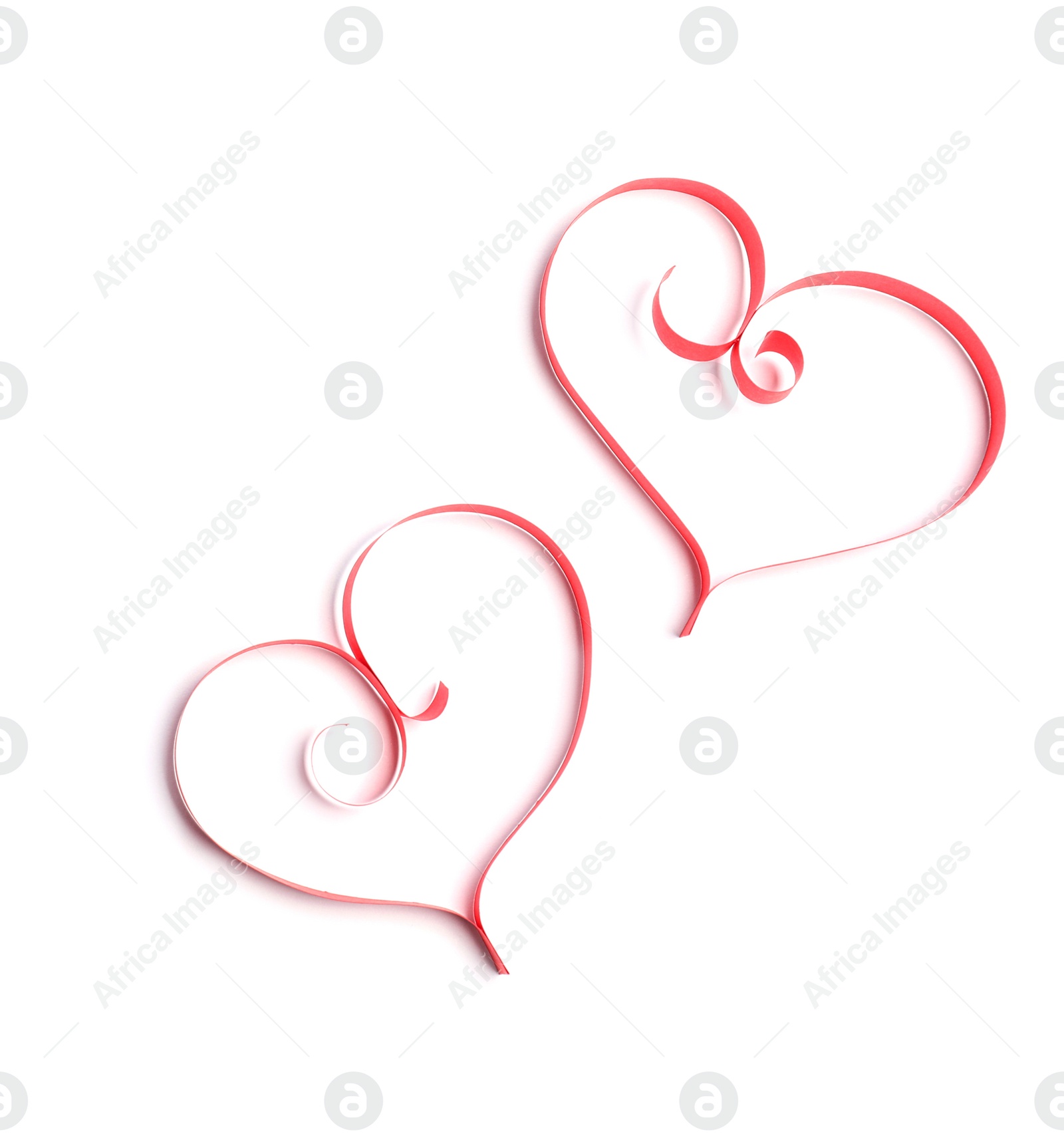 Photo of Hearts made of paper strips on white background, top view. Space for text