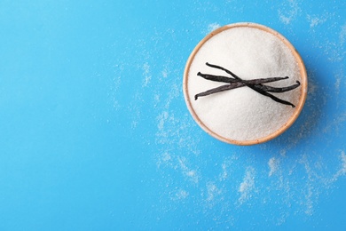 Photo of Bowl with vanilla sugar on color background, top view