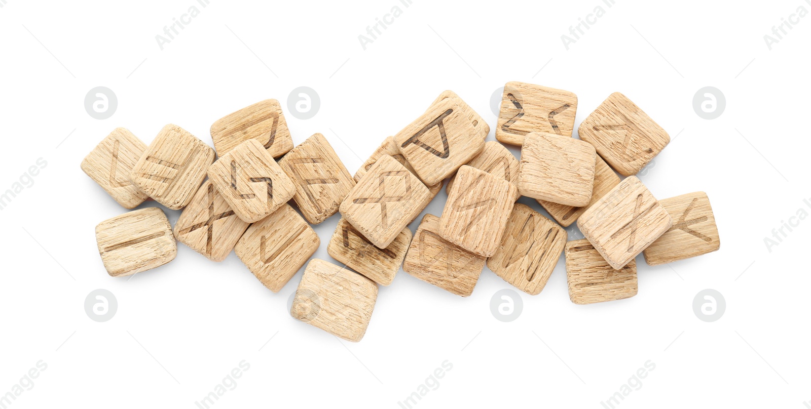 Photo of Pile of wooden runes isolated on white, top view