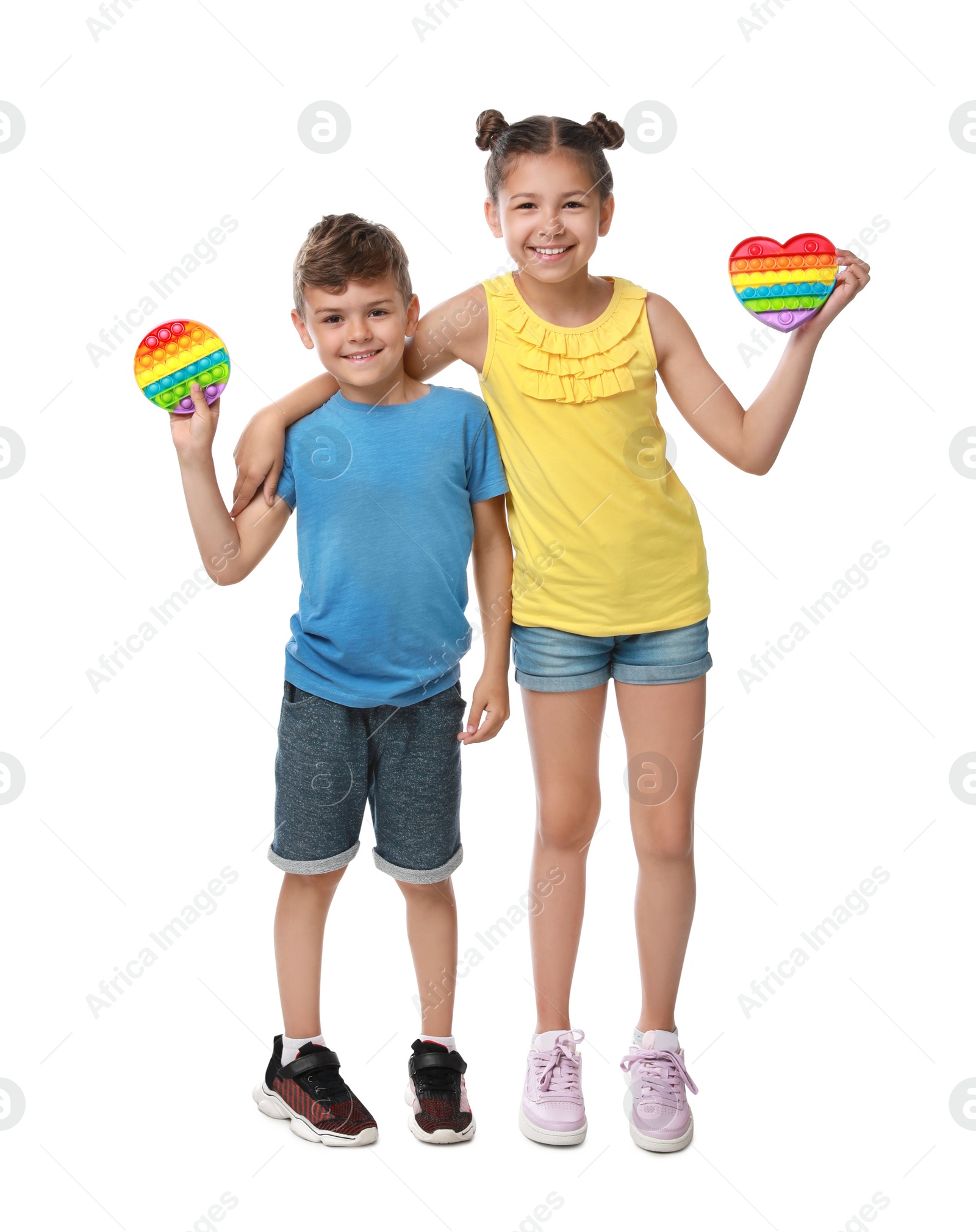 Photo of Children with pop it fidget toys on white background