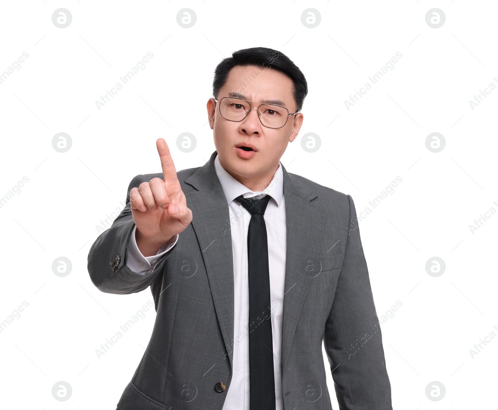 Photo of Angry businessman in suit posing on white background