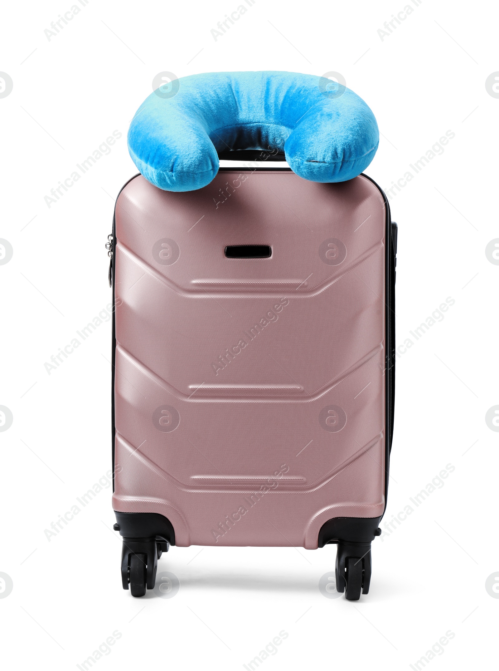 Photo of Soft travel pillow on suitcase isolated on white