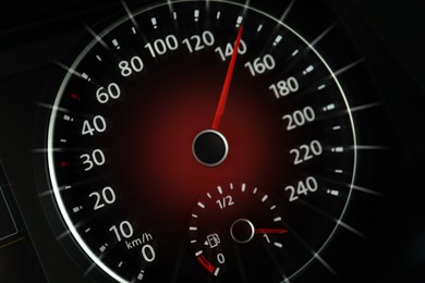 Speedometer on car dashboard, closeup. Motion blur effect