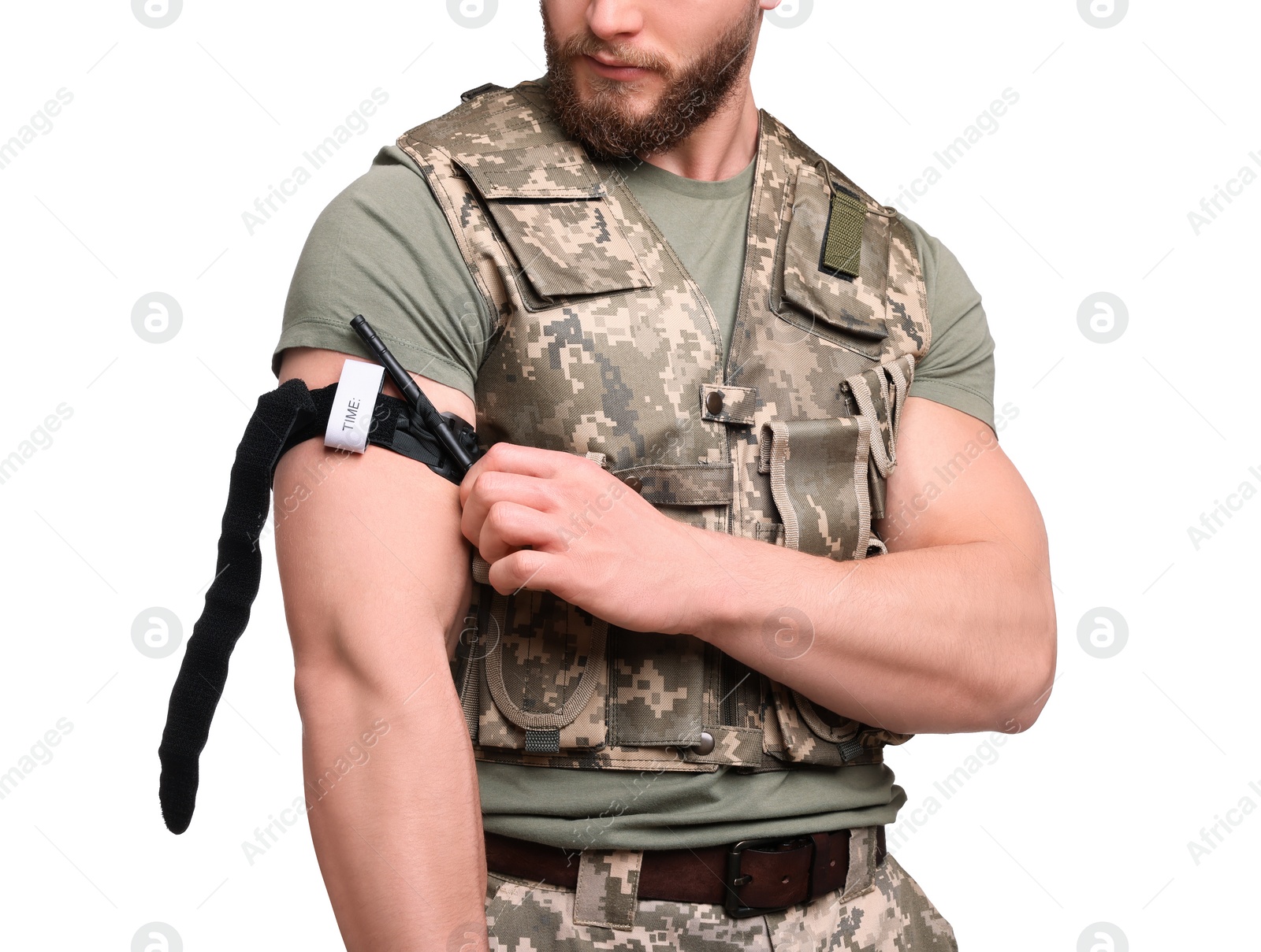 Photo of Soldier in military uniform applying medical tourniquet on arm against white background, closeup