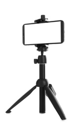 Photo of Smartphone with blank screen fixed to tripod on white background, mockup for design