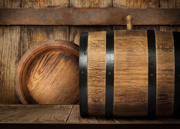 Image of Wooden barrels of different sizes in cellar
