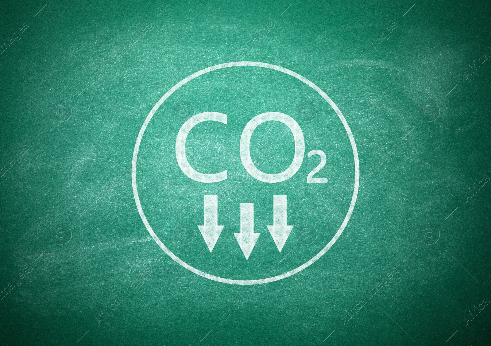 Image of Reduce carbon emissions. Chemical formula CO2 on green chalkboard