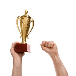 Young man holding gold trophy cup on white background, closeup