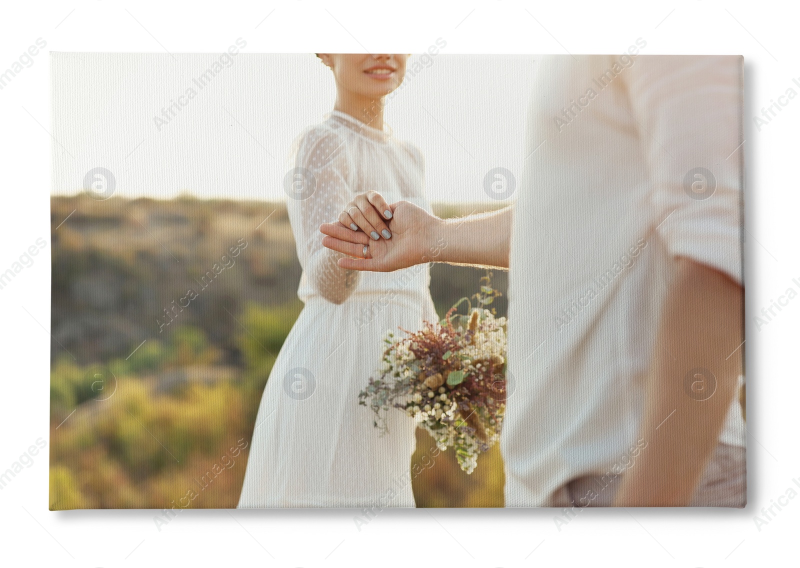 Image of Photo printed on canvas, white background. Happy newlyweds with beautiful bouquet outdoors, closeup