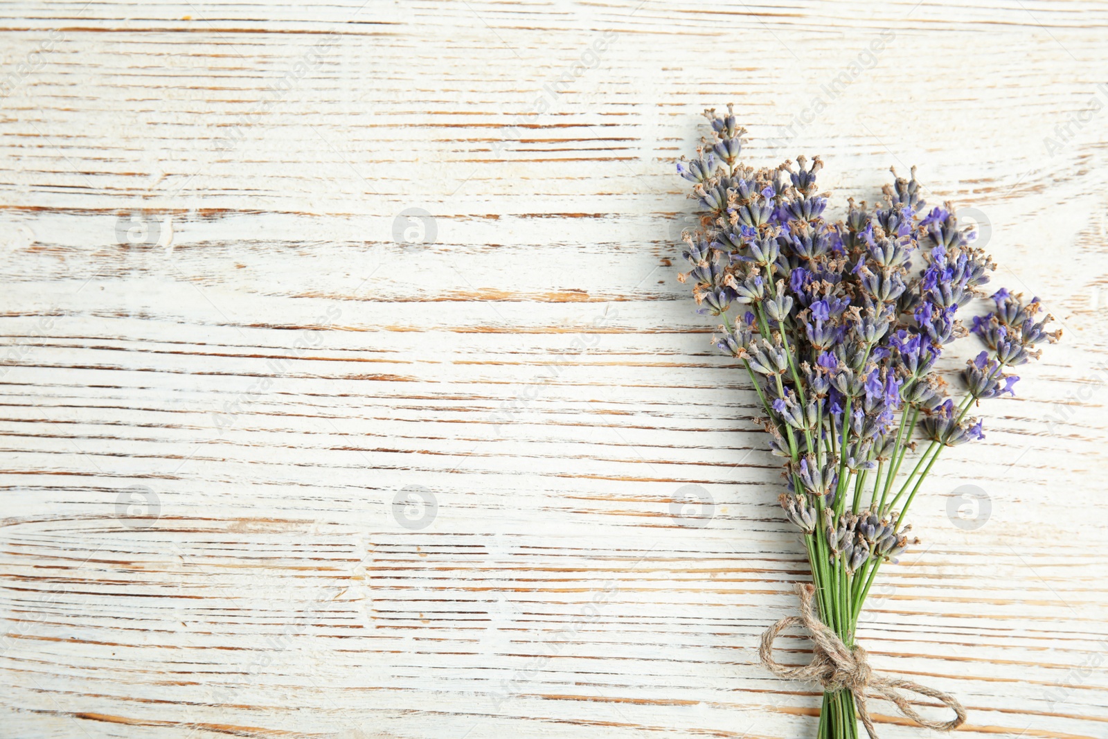 Photo of Blooming lavender flowers on wooden background, top view