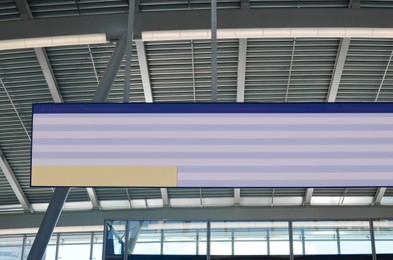 Photo of Display board with departures and arrivals indoors