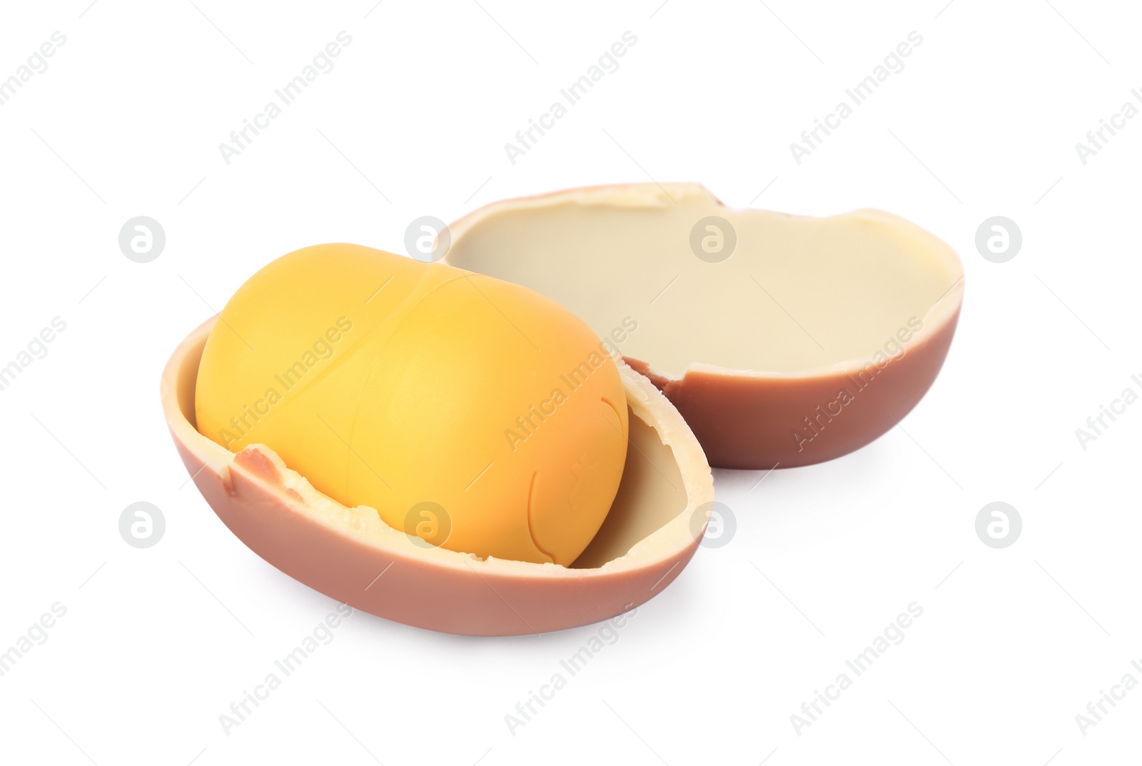 Photo of Slynchev Bryag, Bulgaria - May 23, 2023: Halves of Kinder Surprise Egg and plastic capsule with toy on white background