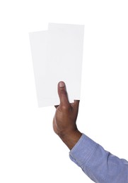Photo of African American man holding flyers on white background, closeup. Mockup for design