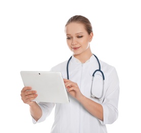 Photo of Portrait of medical doctor with stethoscope using tablet isolated on white