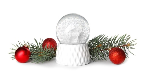 Magical snow globe with pine branches and Christmas balls on white background