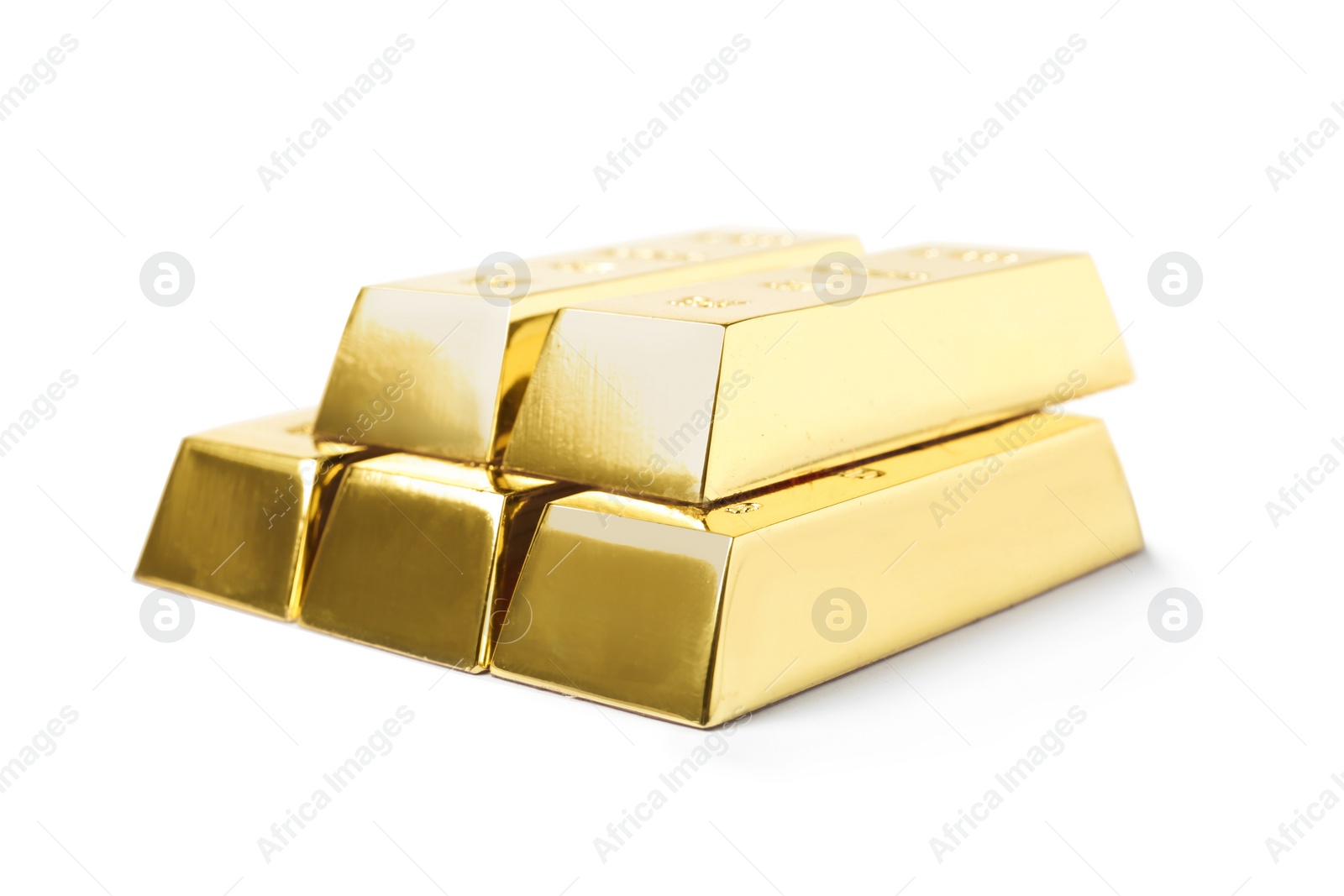 Photo of Stack of shining gold bars isolated on white