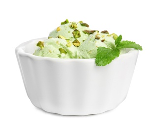 Photo of Bowl of sweet pistachio ice cream with mint on white background