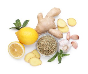 Photo of Ginger, lemon, garlic, dry herbs and fresh mint for cough treatment. Cold remedies on white background, top view