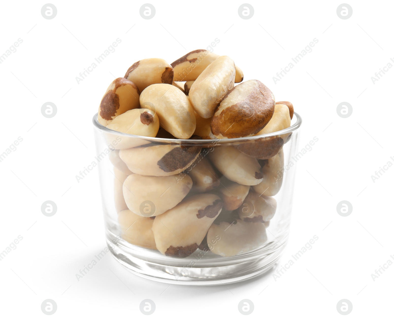 Photo of Glass with Brazil nuts on white background