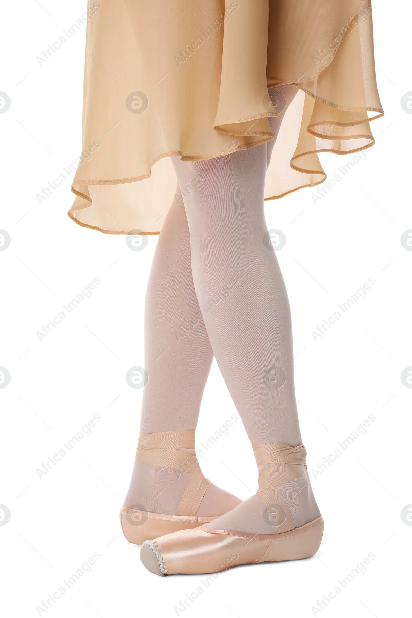 Photo of Ballerina in pointe shoes dancing on white background, closeup