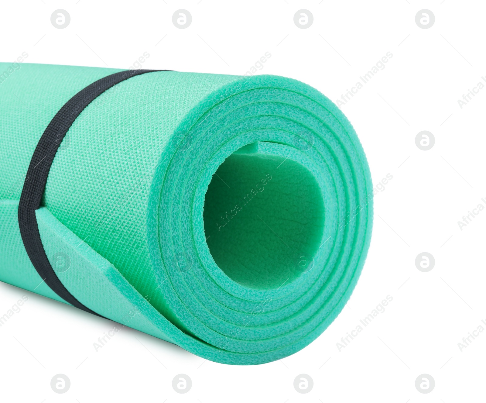 Photo of Rolled camping mat on white background, closeup