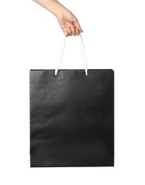 Photo of Woman holding paper shopping bag isolated on white, closeup