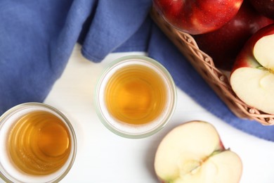 Photo of Flat lay composition with delicious apple cider on white table