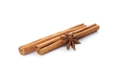 Aromatic cinnamon sticks and anise isolated on white