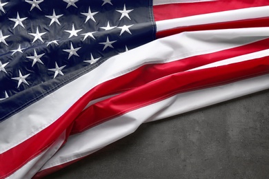 American flag on grey background, space for text