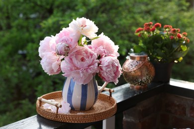 Balcony garden. Beautiful flowers on railings outdoors