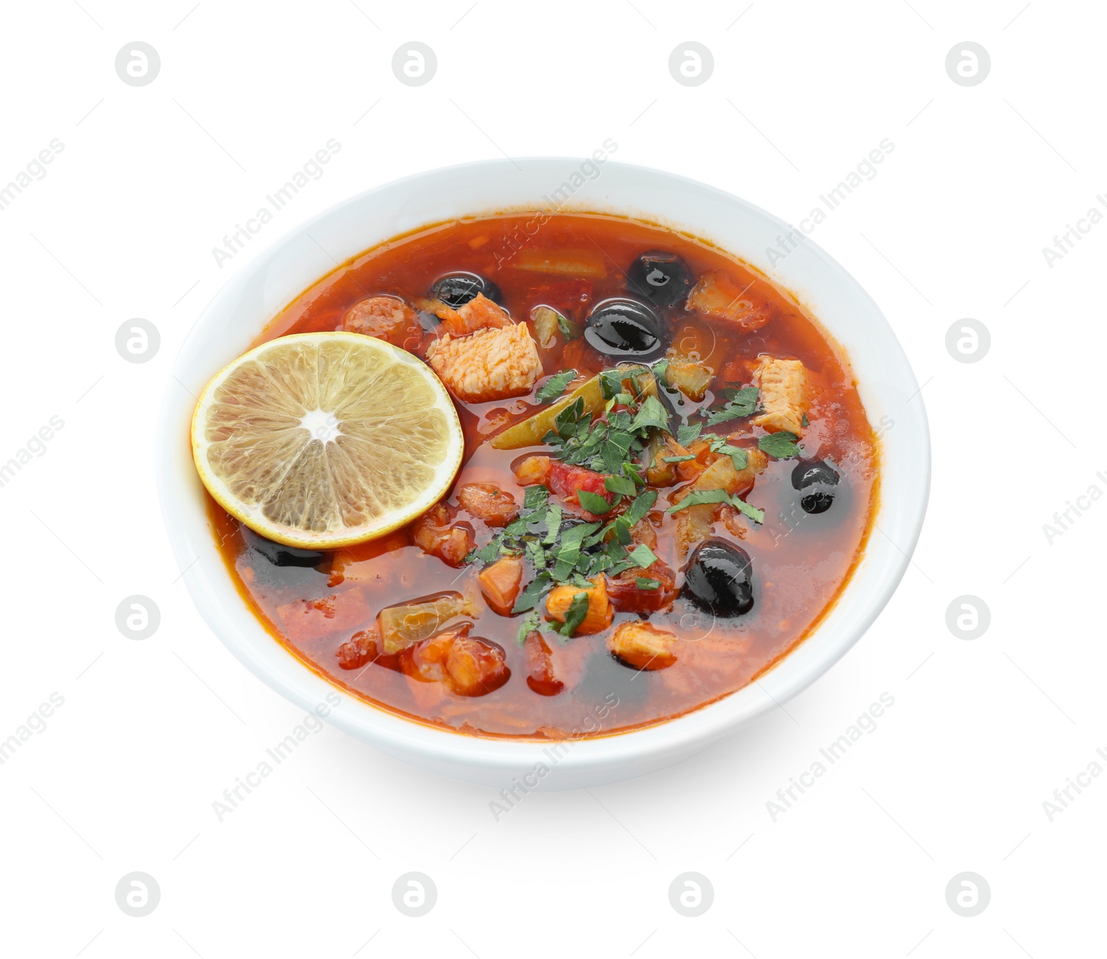 Photo of Meat solyanka soup with sausages, olives and vegetables in bowl isolated on white