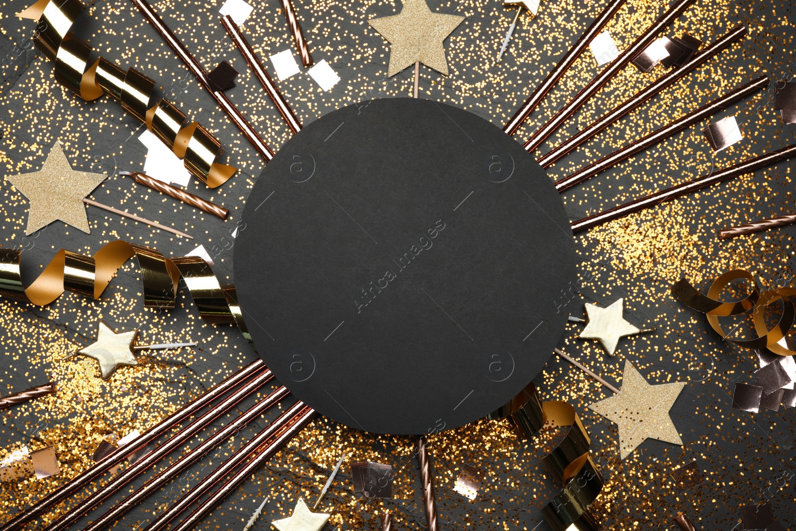 Photo of Flat lay composition with birthday decor and blank card on black background. Space for text