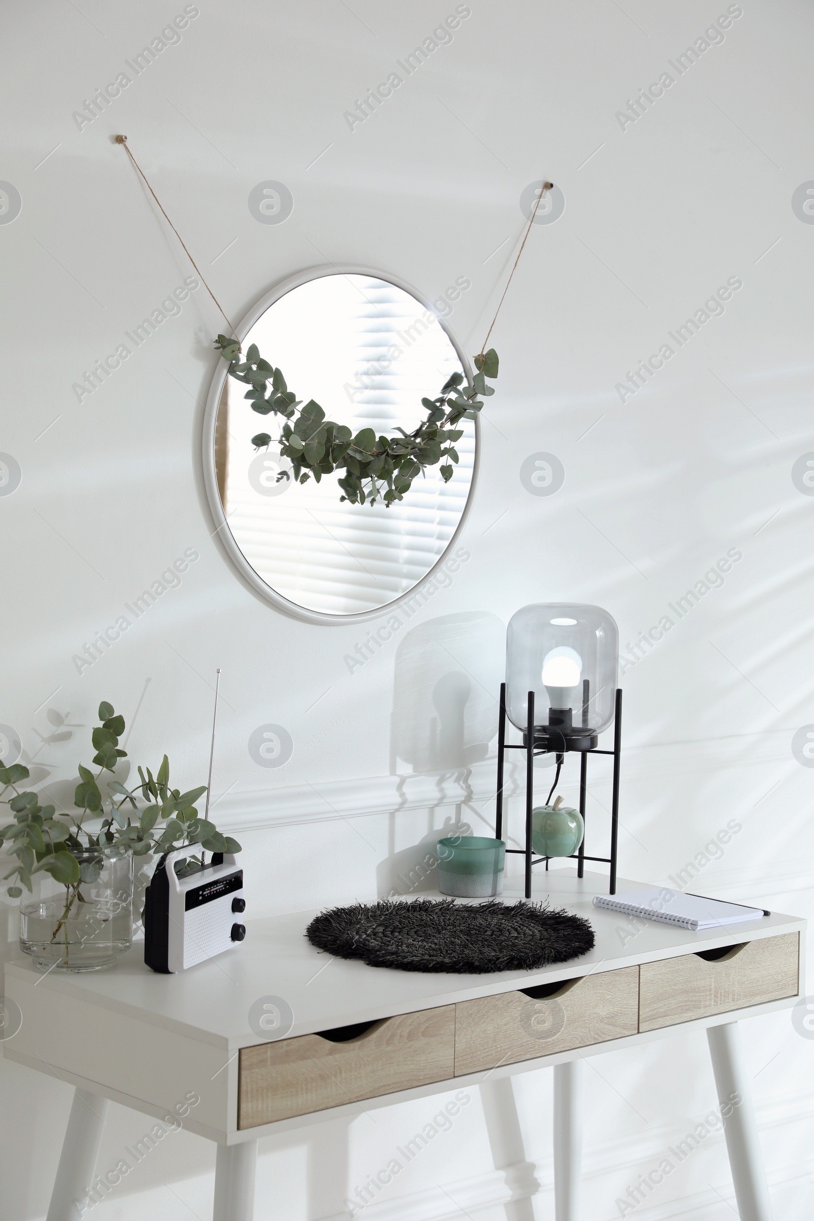 Photo of Stylish room decorated with beautiful eucalyptus garland