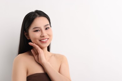 Photo of Portrait of beautiful woman on white background