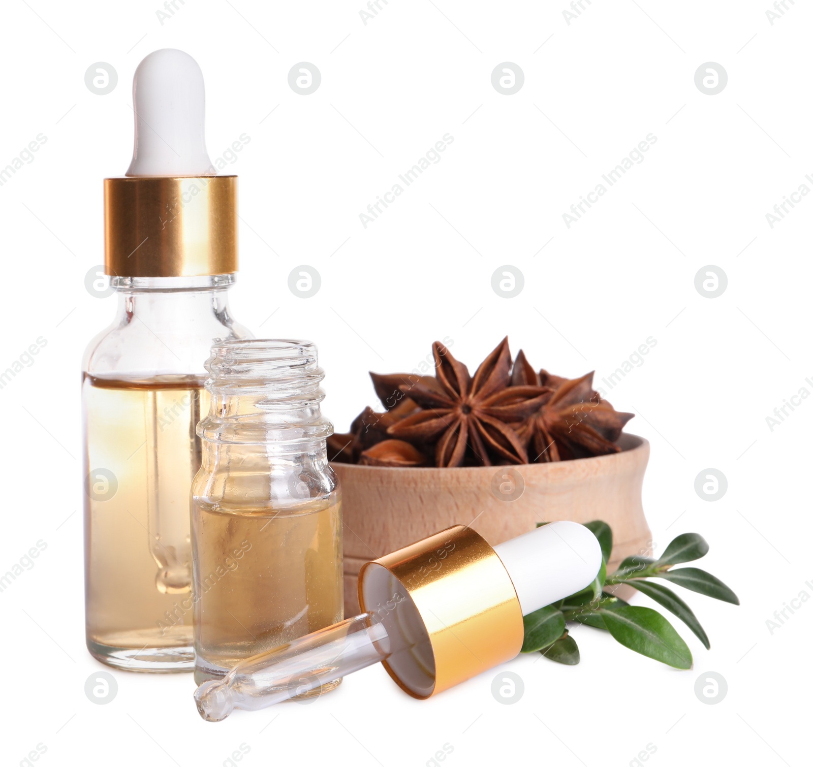 Photo of Anise essential oil and spice on white background