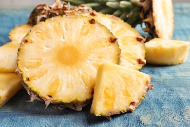 Fresh sliced pineapple on wooden background