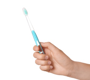 Photo of Woman holding manual toothbrush against white background