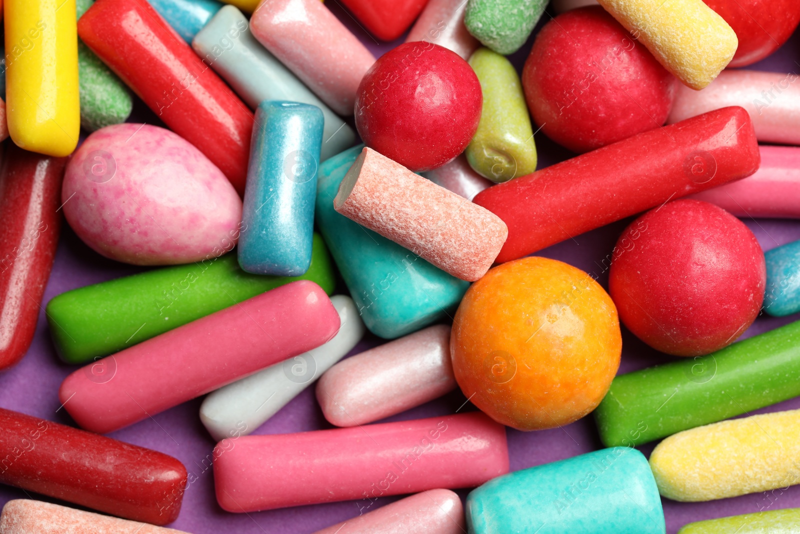 Photo of Many tasty bubble gums as background, closeup