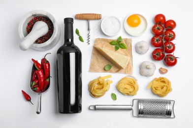 Flat lay composition with wine and fresh ingredients on white background