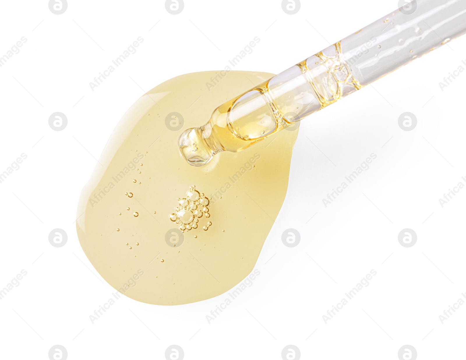 Image of Drop of hydrophilic oil from pipette on white background